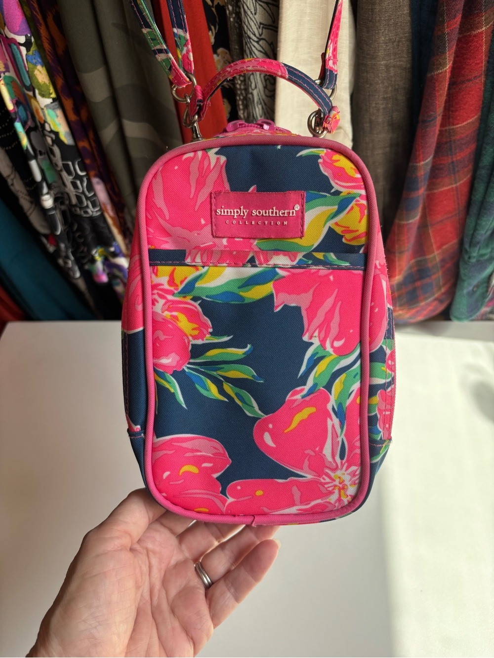 Simply Southern Pink Floral Crossbody Phone Pouch with Navy Background